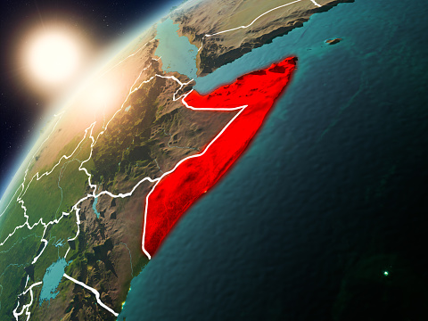 Somalia during sunset highlighted in red on planet Earth with visible country borders. 3D illustration. Elements of this image furnished by NASA.