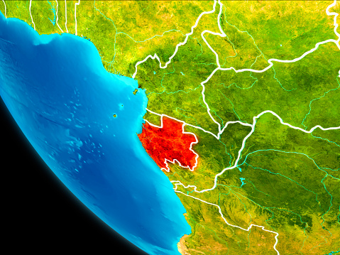 Gabon highlighted in red on planet Earth with visible borders. 3D illustration. Elements of this image furnished by NASA.