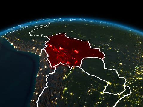 Space orbit view of Bolivia highlighted in red on planet Earth at night with visible country borders and city lights. 3D illustration. Elements of this image furnished by NASA.