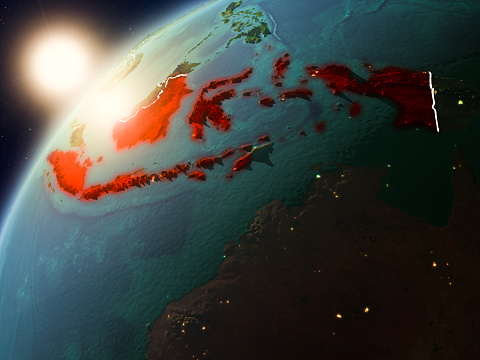 Indonesia during sunset highlighted in red on planet Earth with visible country borders. 3D illustration. Elements of this image furnished by NASA.