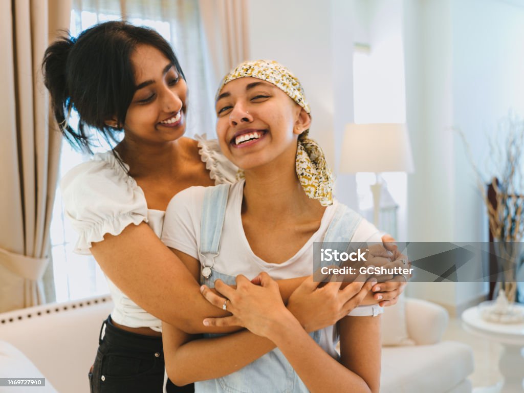 Friendship, Love and Care Group Portrait of sisters smiling at the camera Cancer - Illness Stock Photo