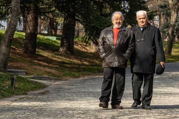 istock Active Senior Old Friends Having A Nice Day At The Park And Cafe, Walking. 1469728903