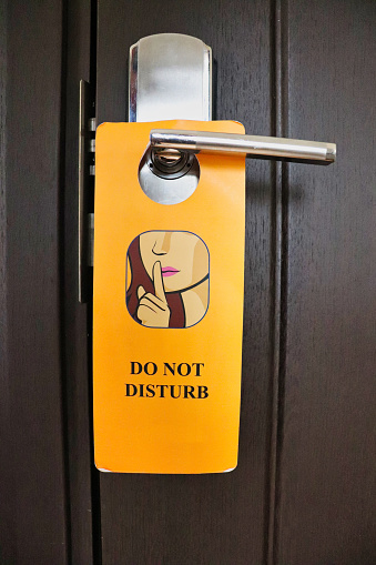 Do not disturb notice on a hotel door handle