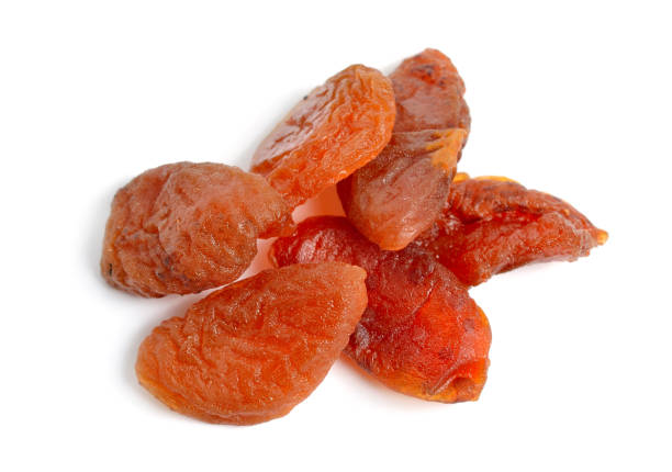 istock Whole Sun-dried apricots without stones. Isolated on white background 1469729327