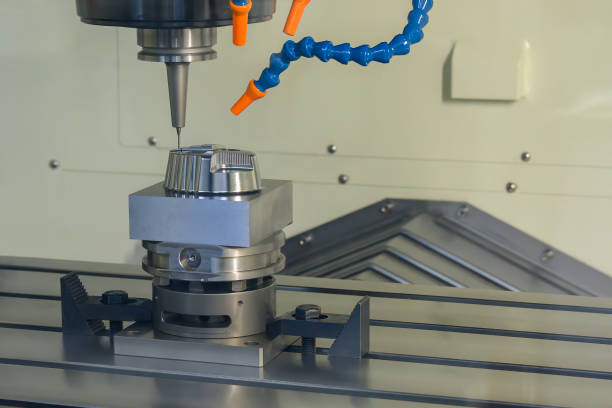 istock The CNC milling machine cutting injection mold part by solid ball end mill tool. 1469733298