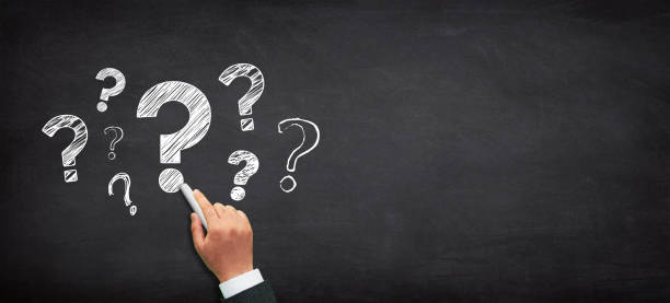 istock Question mark design with a male hand writing on chalkboard 1469734816