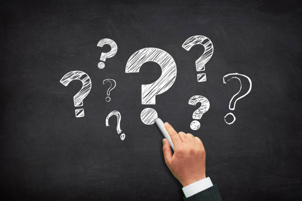 istock Question mark design with a male hand writing on chalkboard 1469734860