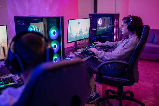 istock Friends playing video games on a computer for a tournament. 1469735049