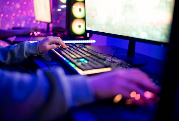 istock Close-up of unrecognizable woman playing games on compiter. 1469735071