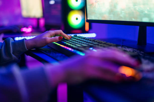 istock Close-up of unrecognizable woman playing games on compiter. 1469735075