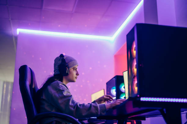 istock Woman playing video games on a computer. 1469735112