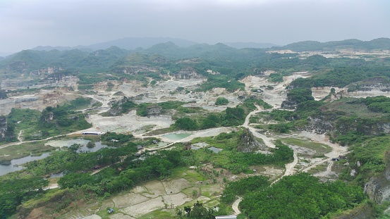 aerial view of limestone mountain as a mining site.