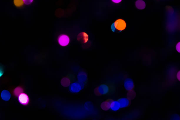 Background Blur. Bright Blurred Sparkles and Colorful Circles on a Dark Background.
