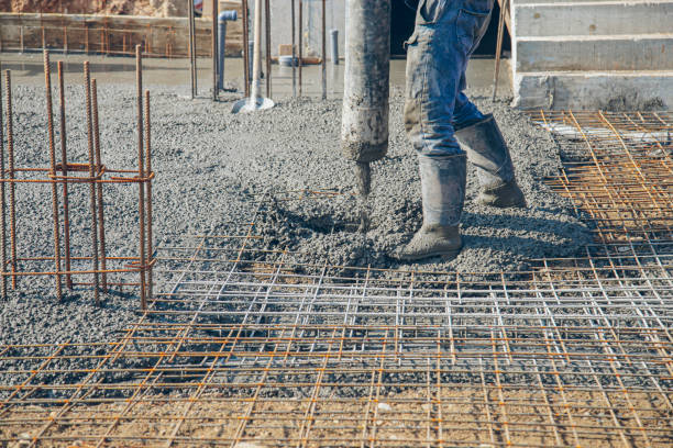 istock Pouring concrete in preset rebar mesh with concrete pump 1469744685