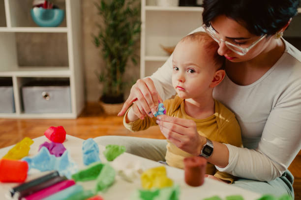 istock Mother and son playing with clay at home and creating art 1469747399