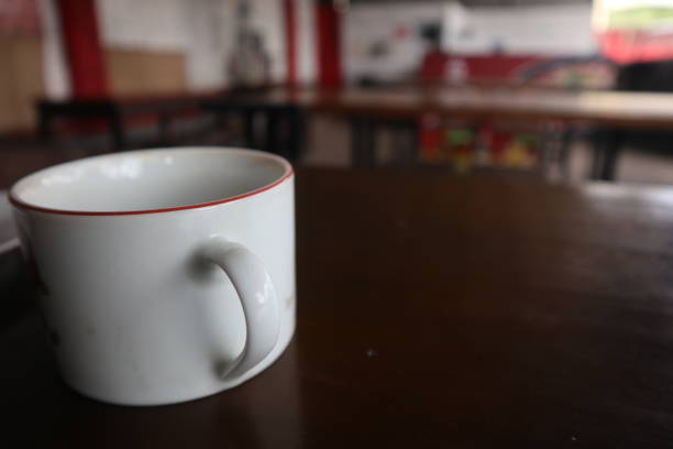 istock An empty cup of coffee on a wooden table 1469748385