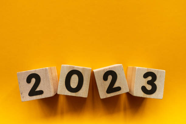 istock New Year 2023 with wood block on yellow background 1469748402
