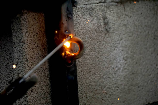 istock welder is welding metal part on a construction site 1469751203
