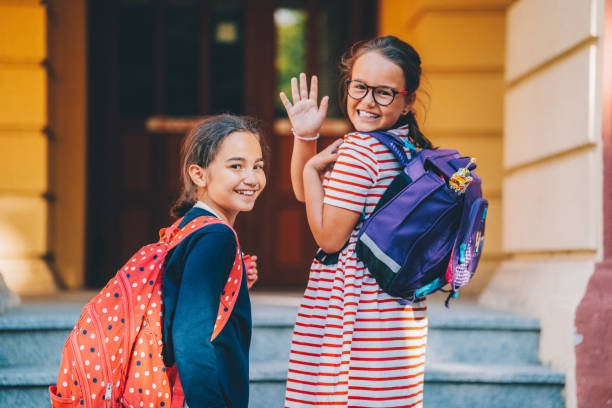 istock Schoolgirls smiling to camera 1469751876