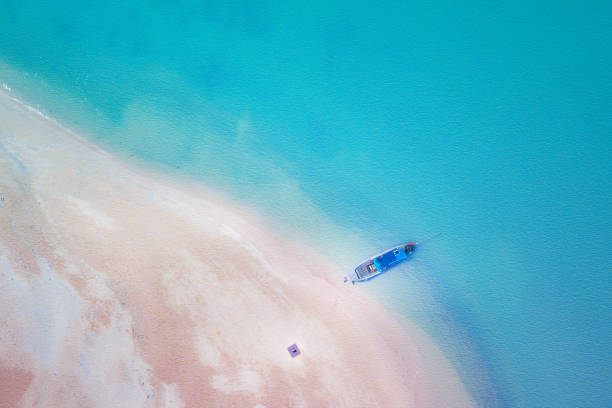 istock long tail boat on the sand beach 1469754551