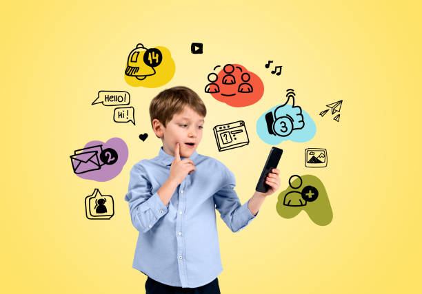 istock School boy with smartphone, social media doodle icons 1469756528