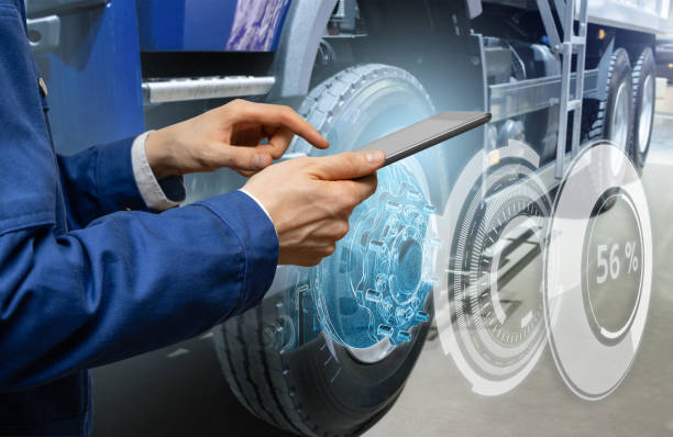 istock Serviceman repairing a truck using AR 1469757000
