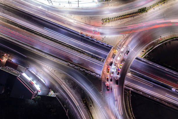 istock Expressway top view, Road traffic an important infrastructure, Drone aerial view fly in circle, traffic transportation, Public transport or commuter city life concept of economic and energ, transport. 1469759836