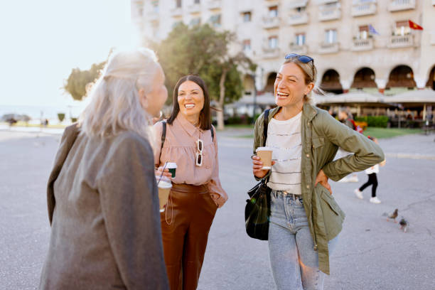 istock Women drinking takeaway coffee and enjoying the sun 1469759879