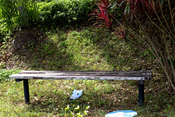 Decaying old park bench in a park in batam city