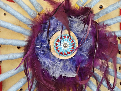 A traditional part of a man's regalia worn during a dance exhibition or Wachipi (Pow Wow) and originates from the Plains region of the United States.