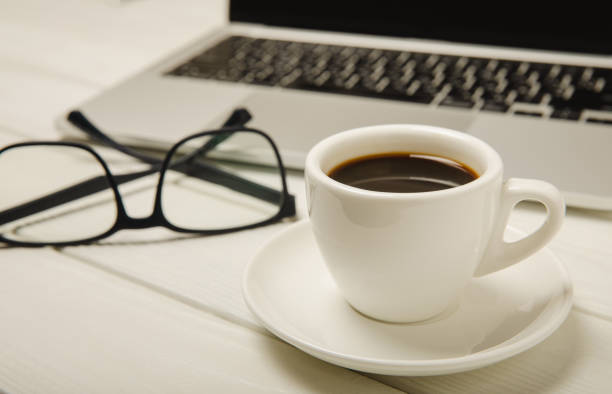 istock Laptop with coffee cup home office.office concept. Business concept. Work at home. Workspace with laptop. Mocap. Place for text. Copy space. 1469768760