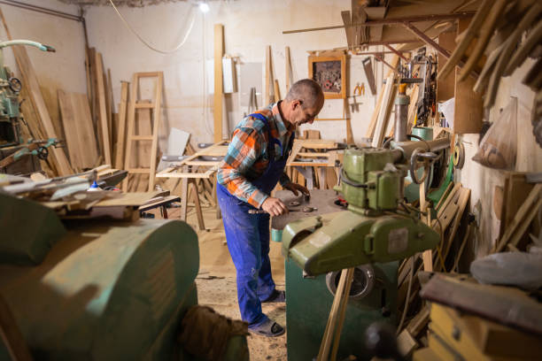 istock Carpenter creating furniture 1469768901
