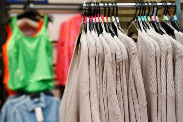 istock Stylish clothes on hangers in the store 1469769331