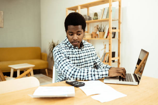 istock Young African American managing his monthly costs 1469770240