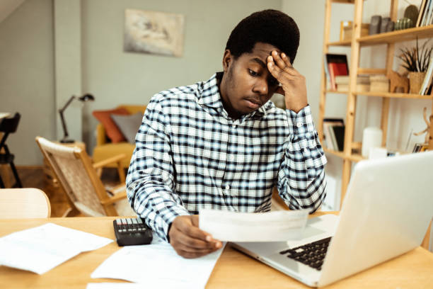 istock Worried African American trying to plan his expanses 1469770249