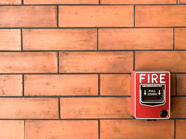 istock The fire alarm switch on the orange wall 1469770276