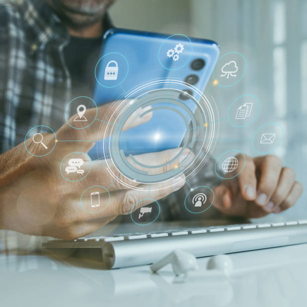 istock Man working on digital applications with pc and smartphone. New technology app, workflow concept. 1469771344