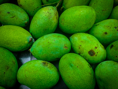Green mango fruit that is very delicious in the supermarket box