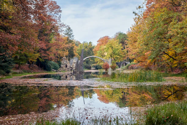 istock Stone arch bridge Kromlau in autumn, called Rakotz Bridge or devils bridge 1469775752