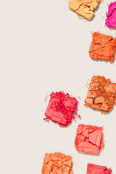 istock Beauty product eyeshadows for makeup as minimal pattern on beige background, flat lay yellow red color swatch eyeshadows, cosmetic textures, color pallete, top view still life, copyspace 1469775887