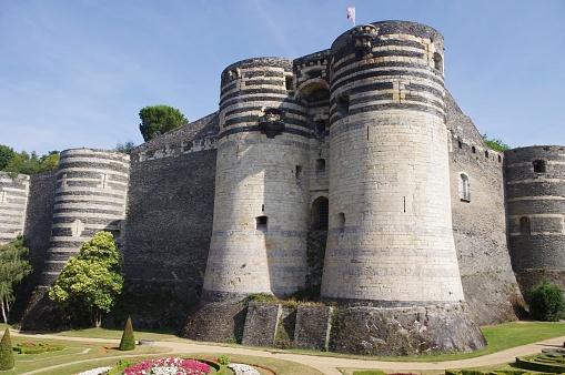 The castle was built in the 13th century by Blanche de Castille. It has 17 towers of about 30 meters high.\nThe city of Angers is located in Maine-et-Loire. It is a medium-sized city.