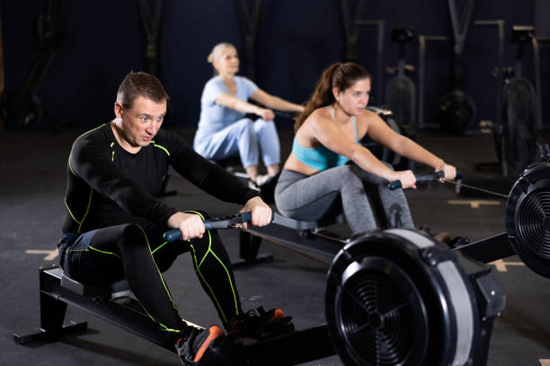istock Sporty male athlete using cable row machine in gym 1469781193