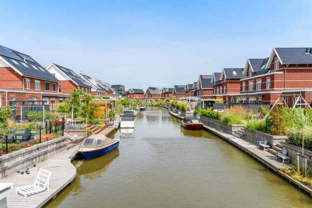istock Energy efficient houses along a canal on a clear summer day 1469781541