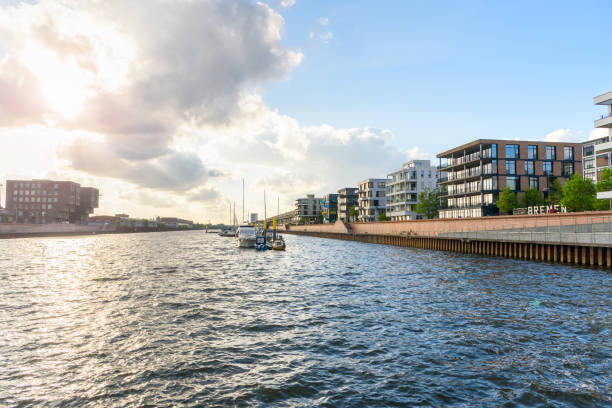 Modern harbourside apartment buildings at sunset stock photo