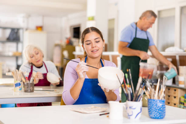 istock woman paints  vase that she made herself 1469782132