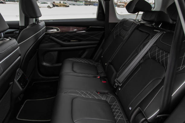 Modern car interior. Clean rear seats with the belts. Three rear seats in the row. Leather light back passenger seats. Modern car interior. Clean rear seats with the belts. Three rear seats in the row. Leather light back passenger seats. Haval H9 SUV stock pictures, royalty-free photos & images