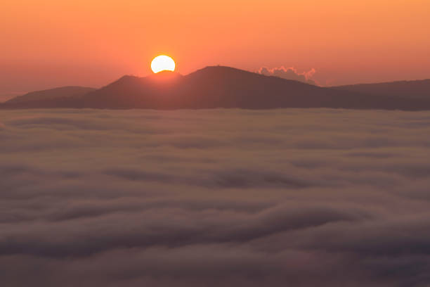 istock Cloud inversion above the CHKO Ceske Stredohori in Czechia during autumn sunset. 1469783558