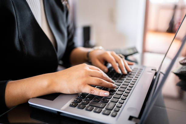 istock Close-up of a woman using laptop 1469784003
