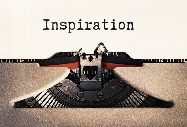 istock Typewriter types the word Inspiration on a sheet of paper 1469785594