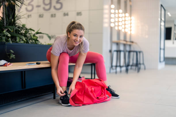 istock Young woman getting ready for training session in gym 1469786493